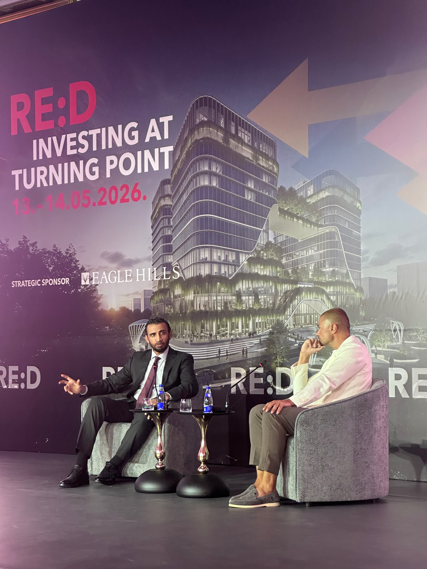 H.E. Mohammed Al-Shaibani of the Investment Corporation of Dubai on stage at RE:D Conference 2026 in Budva, in front of an Eagle Hills development render